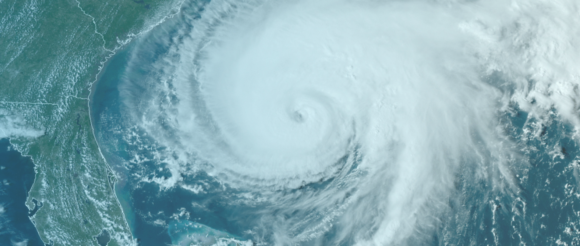 Screen capture of a news report showing a satellite view of a hurricane